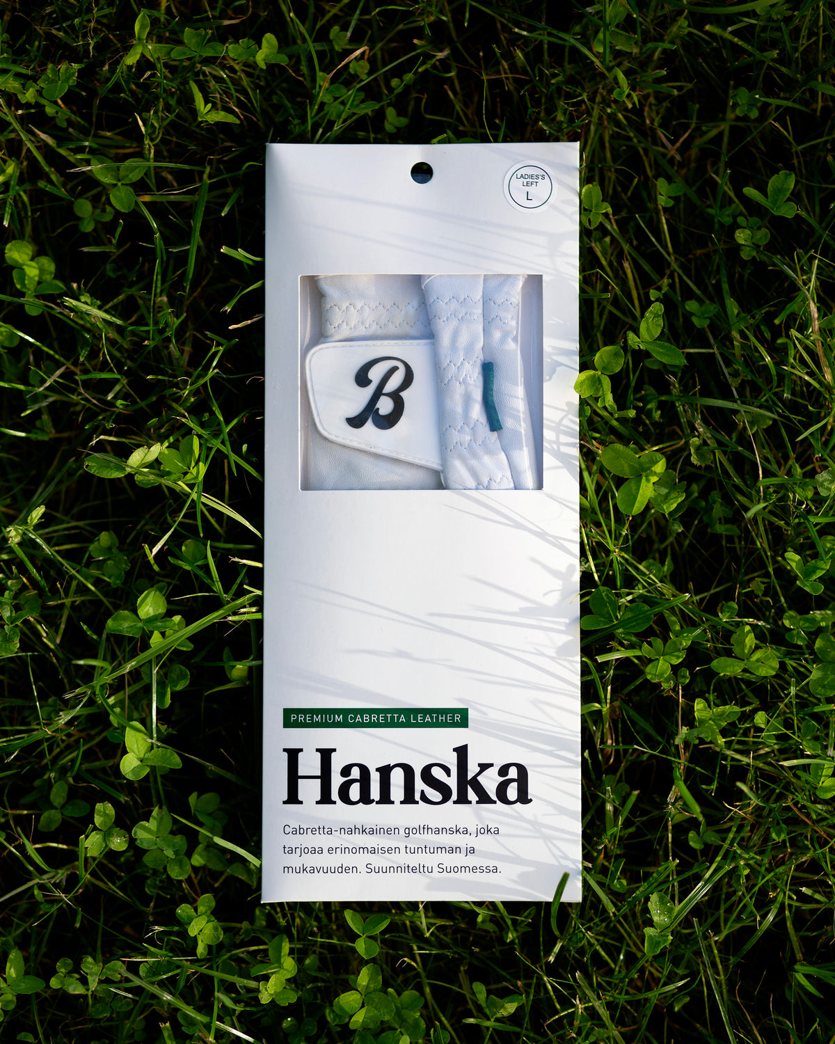Member Glove product packaging card, showing "Hanska" branding and the "B" logo through the window