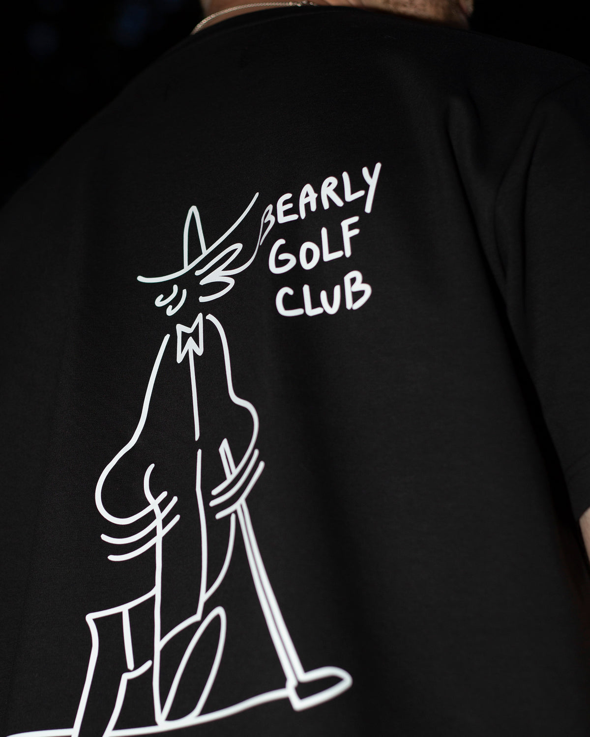 Close-up of the Gus Gus character line drawing and "Bearly Golf Club" text on the back print
